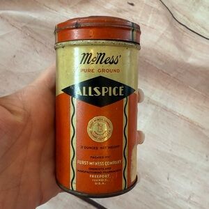 vintage McNess Allspice tin shaker with expired content